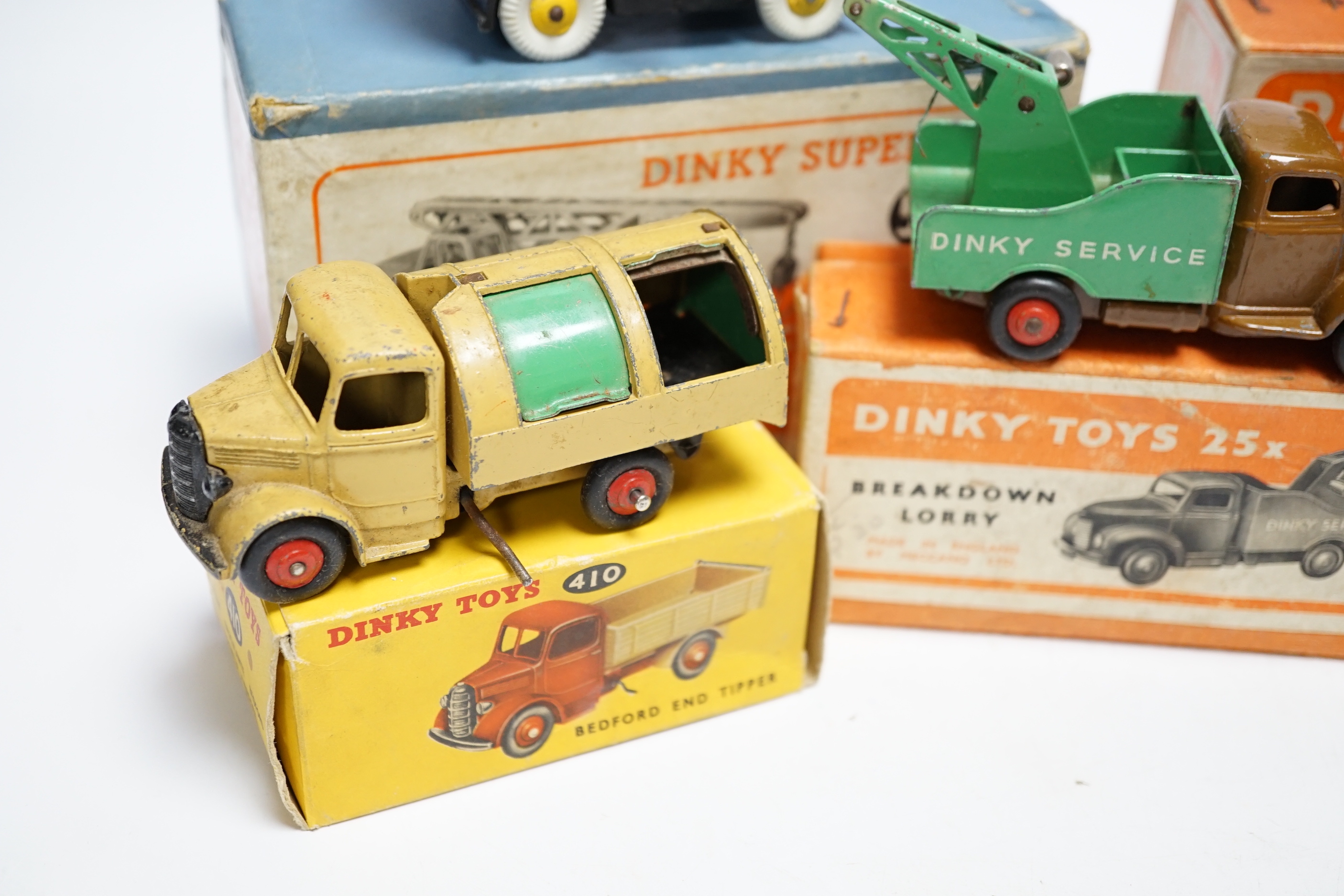 Five boxed dinky toys including (25x) breakdown lorry, (410) Bedford End Tipper, (555) Fire Engine, (571) Coles Mobile Crane, and (14c) Coventry Climax Fork Lift Truck